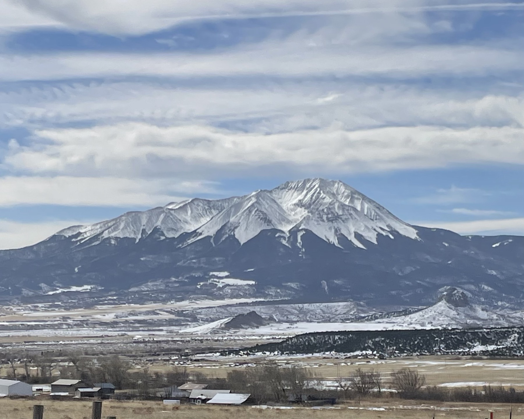 Snow-capped peak above a San Luis Valley ranch in winter